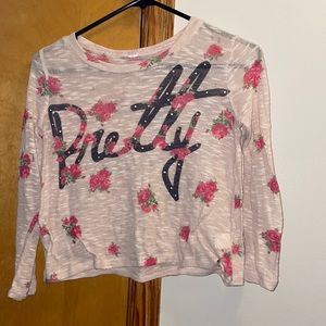 Mesh shirt. With flowers and the word “Pretty” on it.